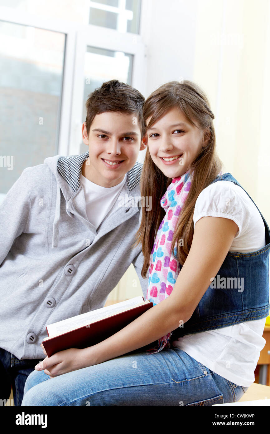 Portrait of happy guy and girl looking at camera Stock Photo - Alamy