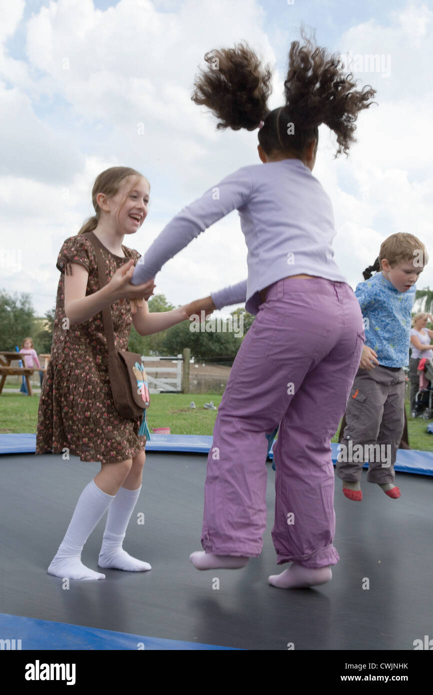 Children bouncing on a trampoline Stock Photo Alamy