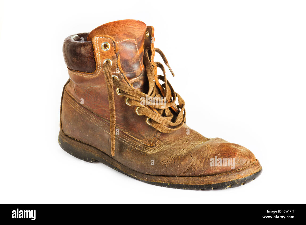 Old worn brown leather work boot on white Stock Photo