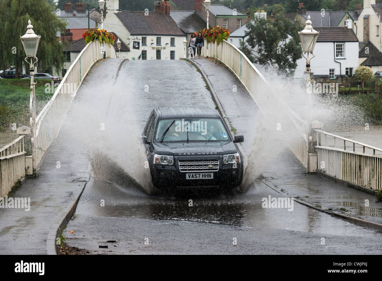 RANGE ROVER IN FLOOD ON OLD WYE BRIDGE CHEPSTOW SUMMER 2012. THE BRIDGE FORMS PART OF THE BORDER BETWEEN ENGLAND & WALES. Stock Photo