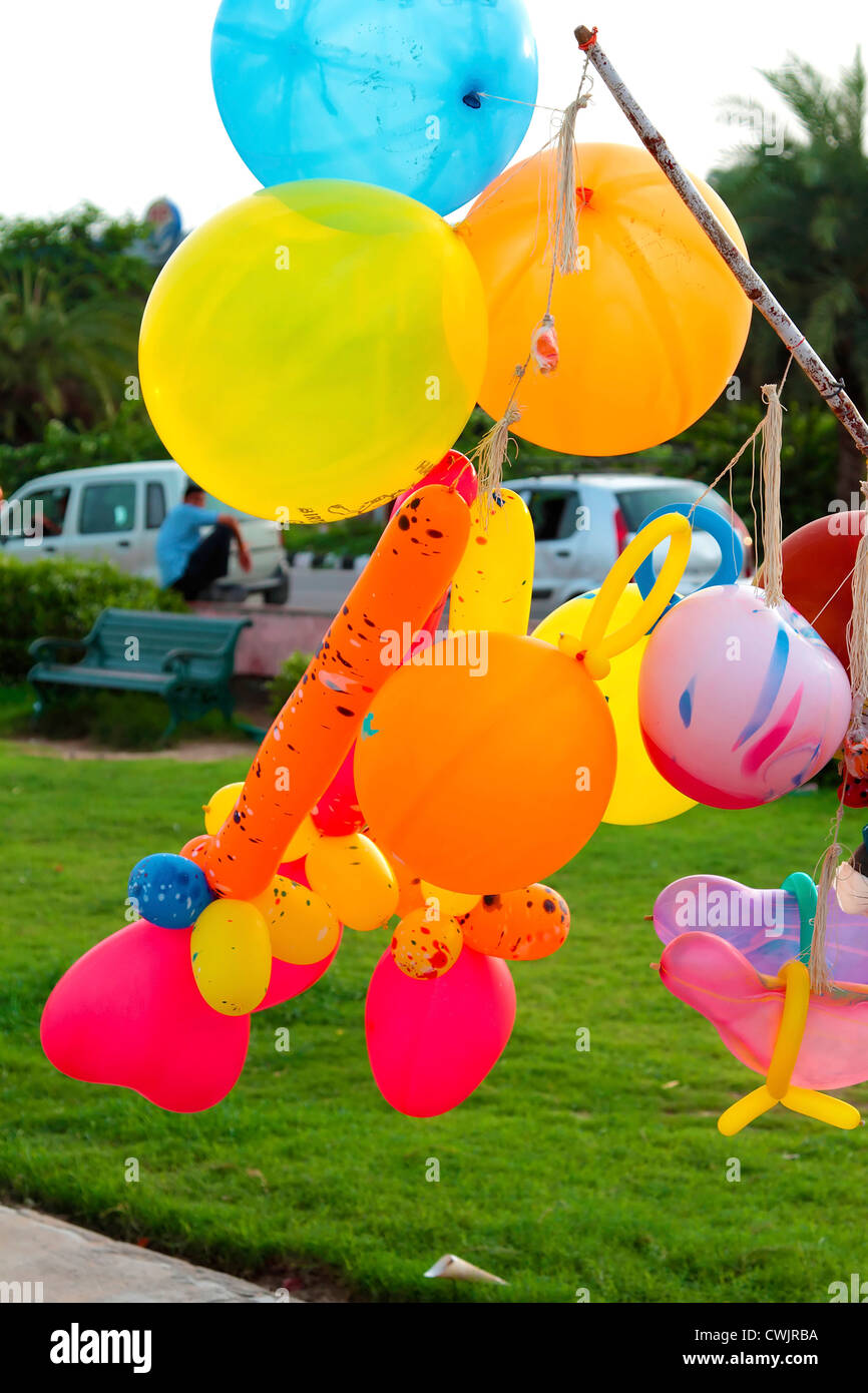 Man selling balloons to city Stock Photo Alamy