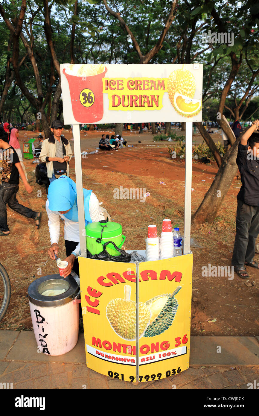 A Muslim woman sells Durian flavored ice cream during Ramadan celebrations in Merdeka Square Stock Photo
