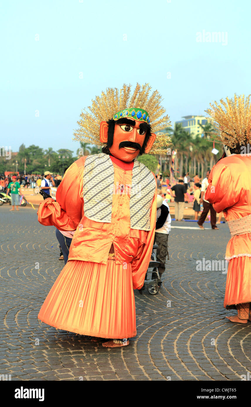 Ondel Ondel human dancing puppets in Merdeka Square, Jakarta. Stock Photo
