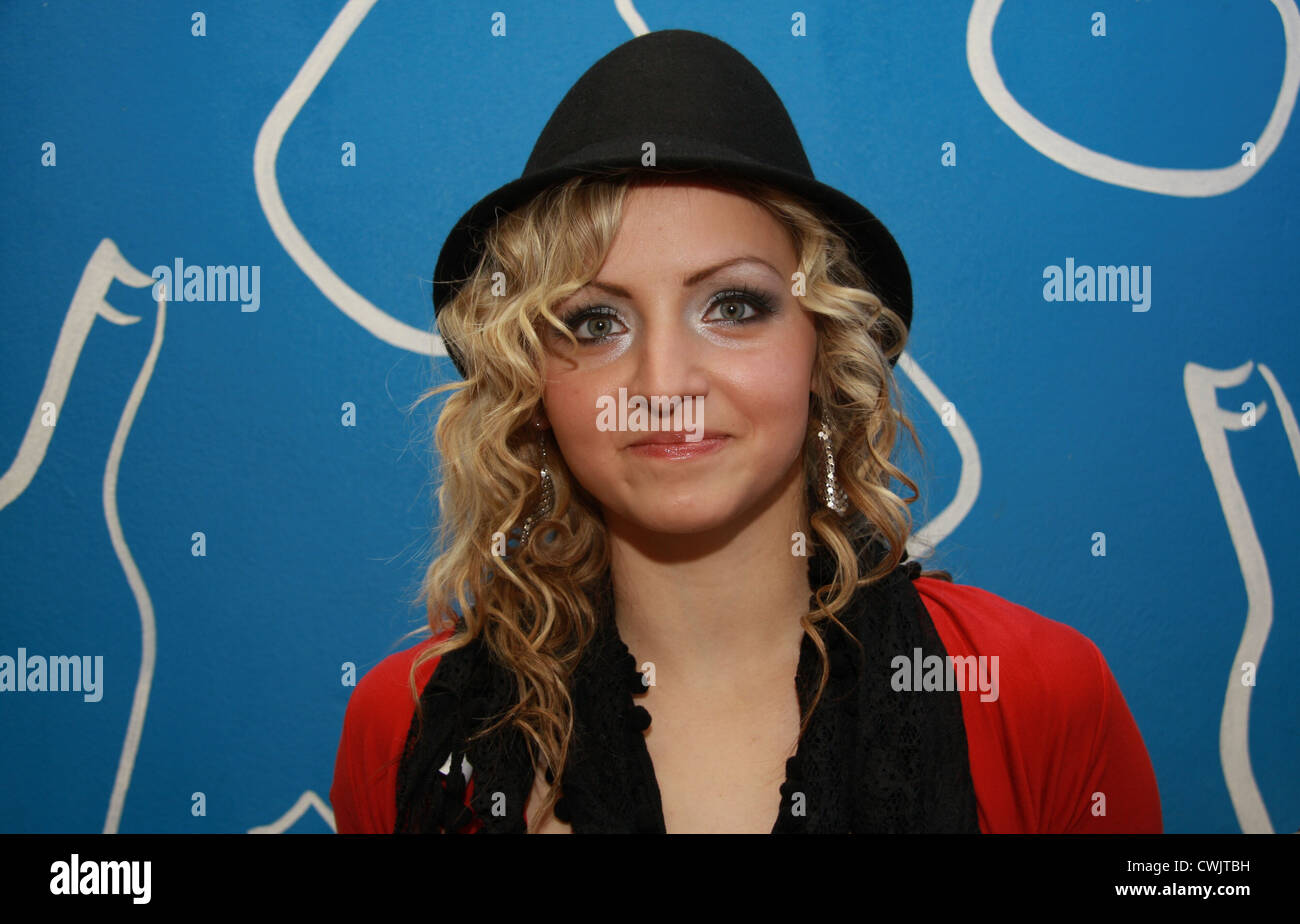 Young Girl with Black Hat Stock Photo - Alamy