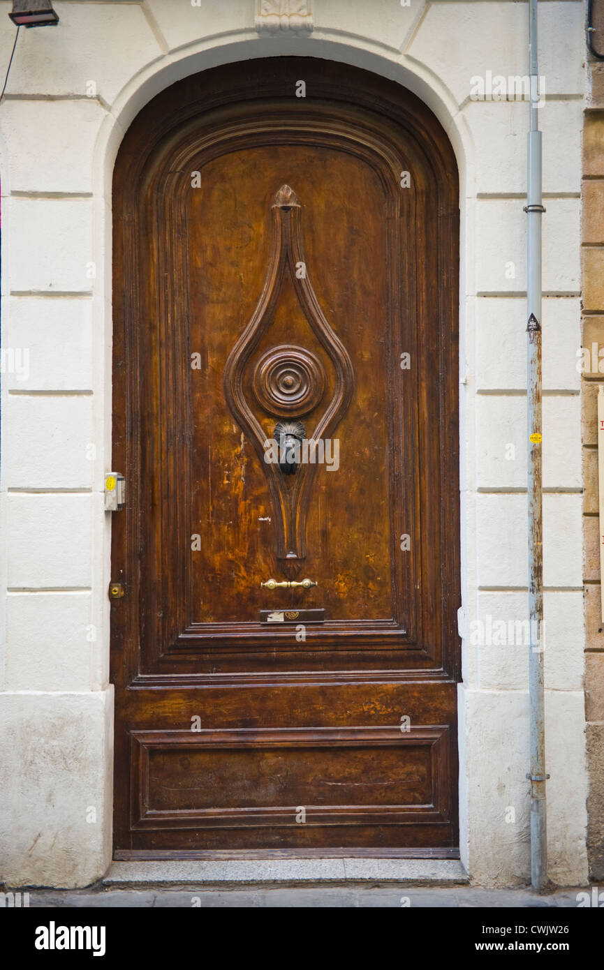 Huge Wooden Front Door With Hand Style Knocker Of Apartment