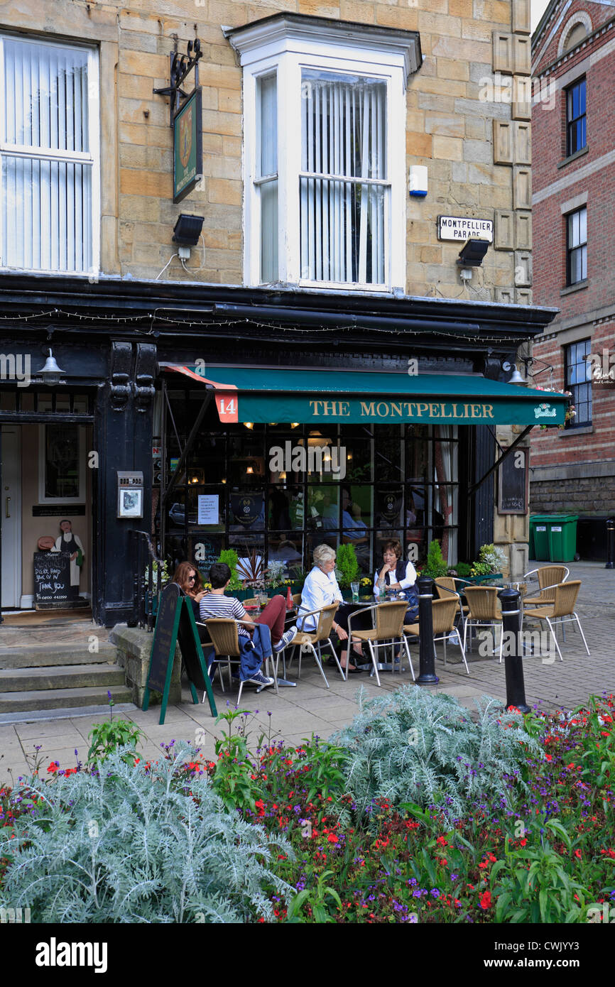 Tourists sat outside The Montpelier Pub in the Montpelier Quarter, Harrogate, North Yorkshire, England, UK. Stock Photo