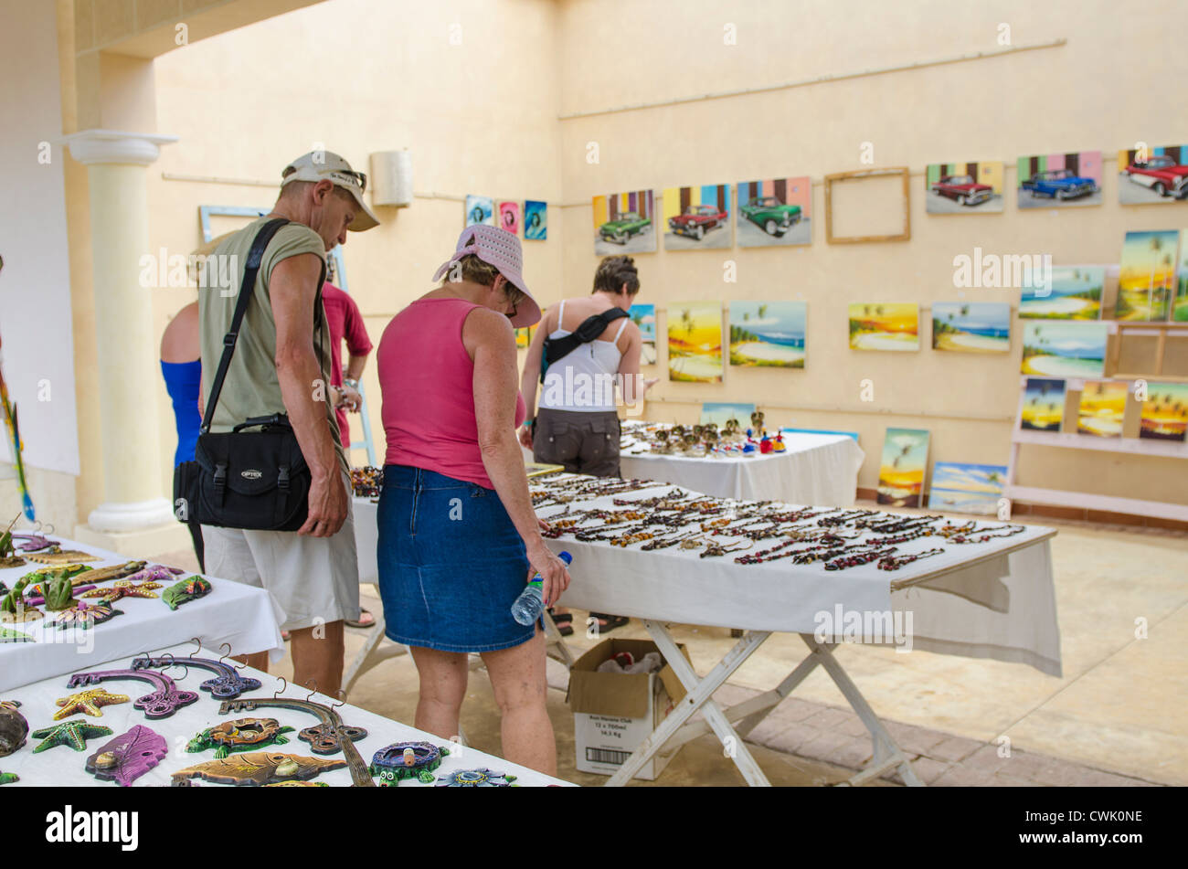 Tourists shopping for Cuban souvenirs, Cuba. Stock Photo