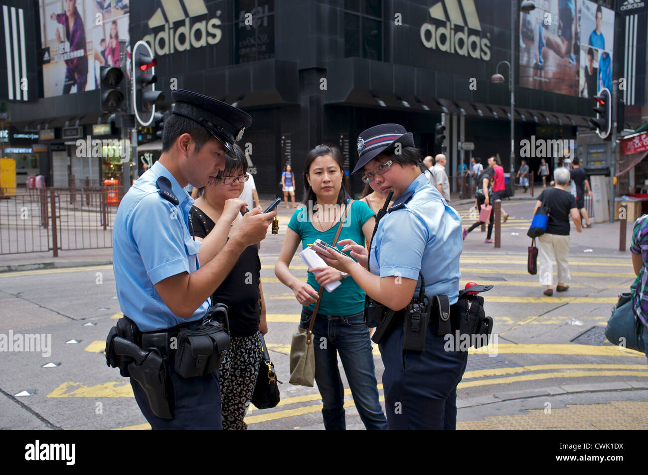Hong Kong police patrolling on street. 25-Aug-2012 Stock Photo