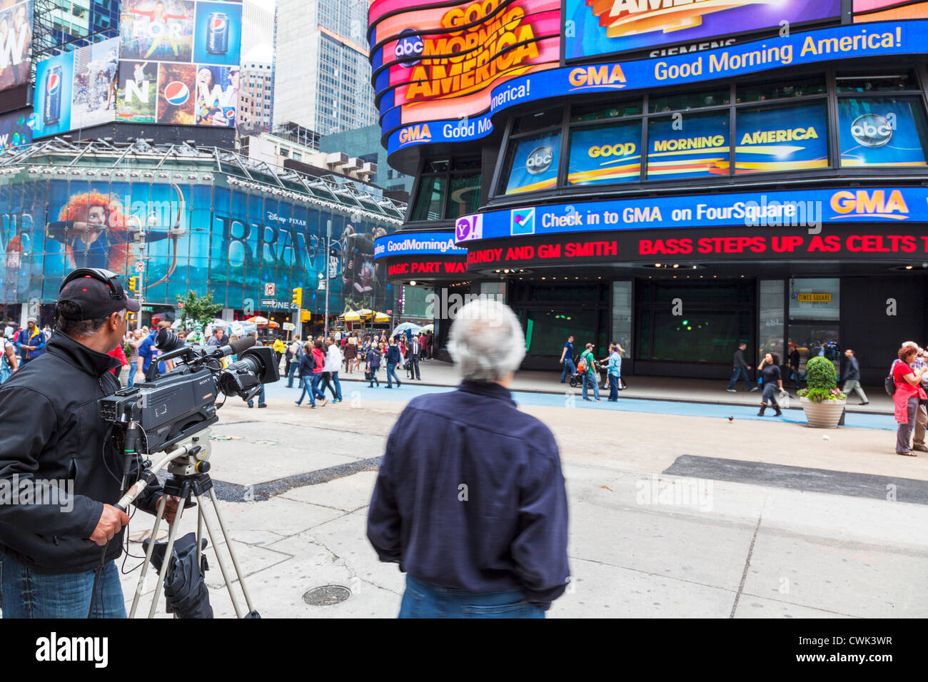 Film crew filming outside in Times Square, Manhattan, New York City