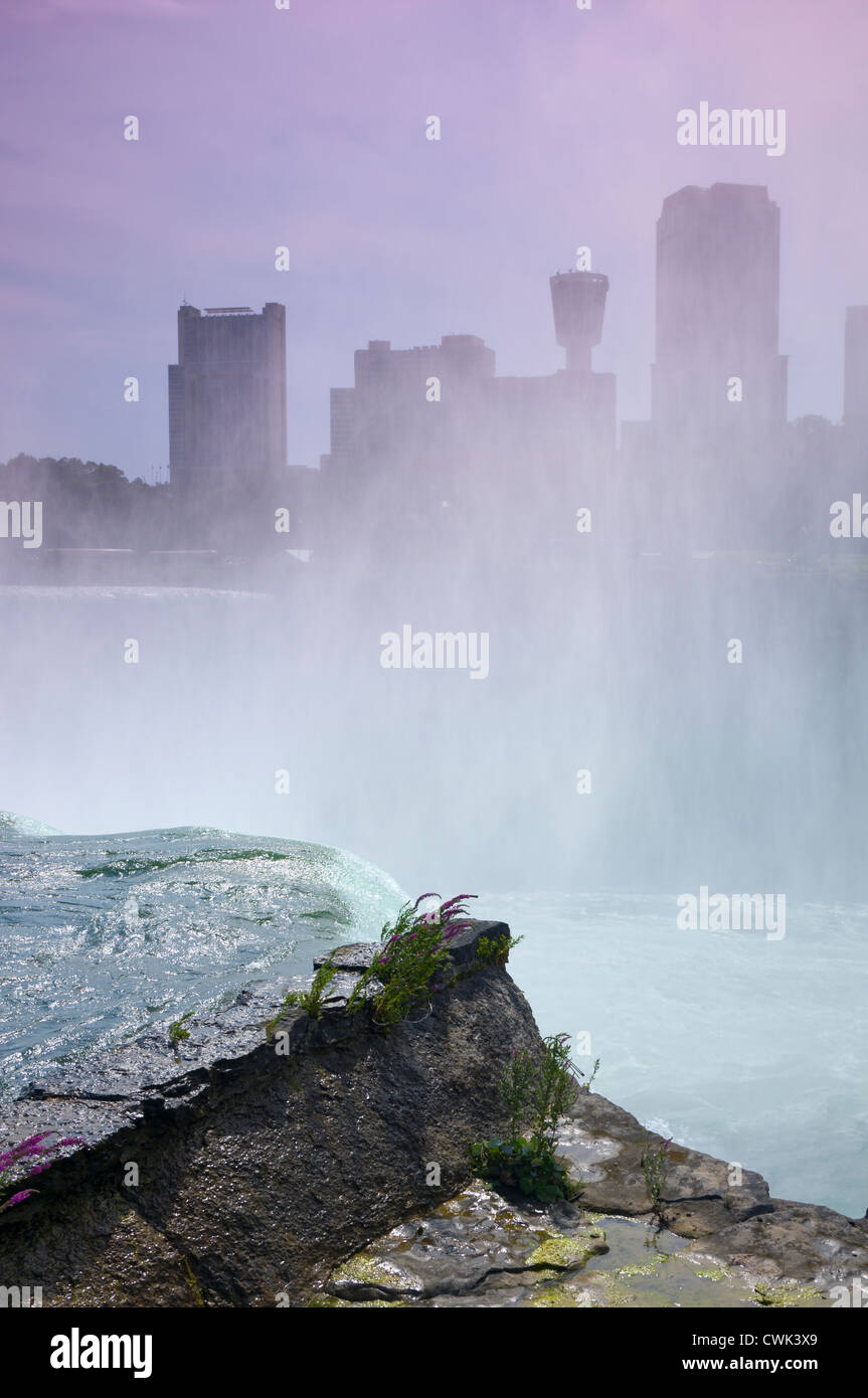American and Horseshoe Falls at Niagara with mist obscuring Canadian skyline and river gorge below Stock Photo