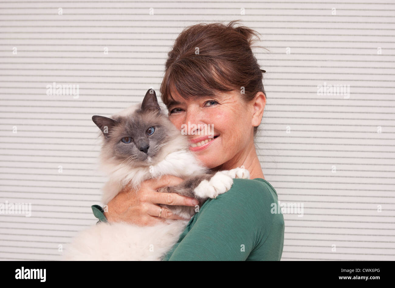 woman and Birman cat Stock Photo