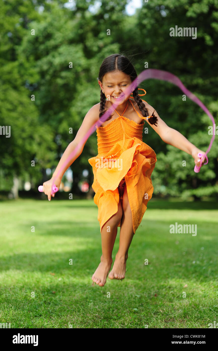 Little girl skipping skipping rope hi-res stock photography and images ...