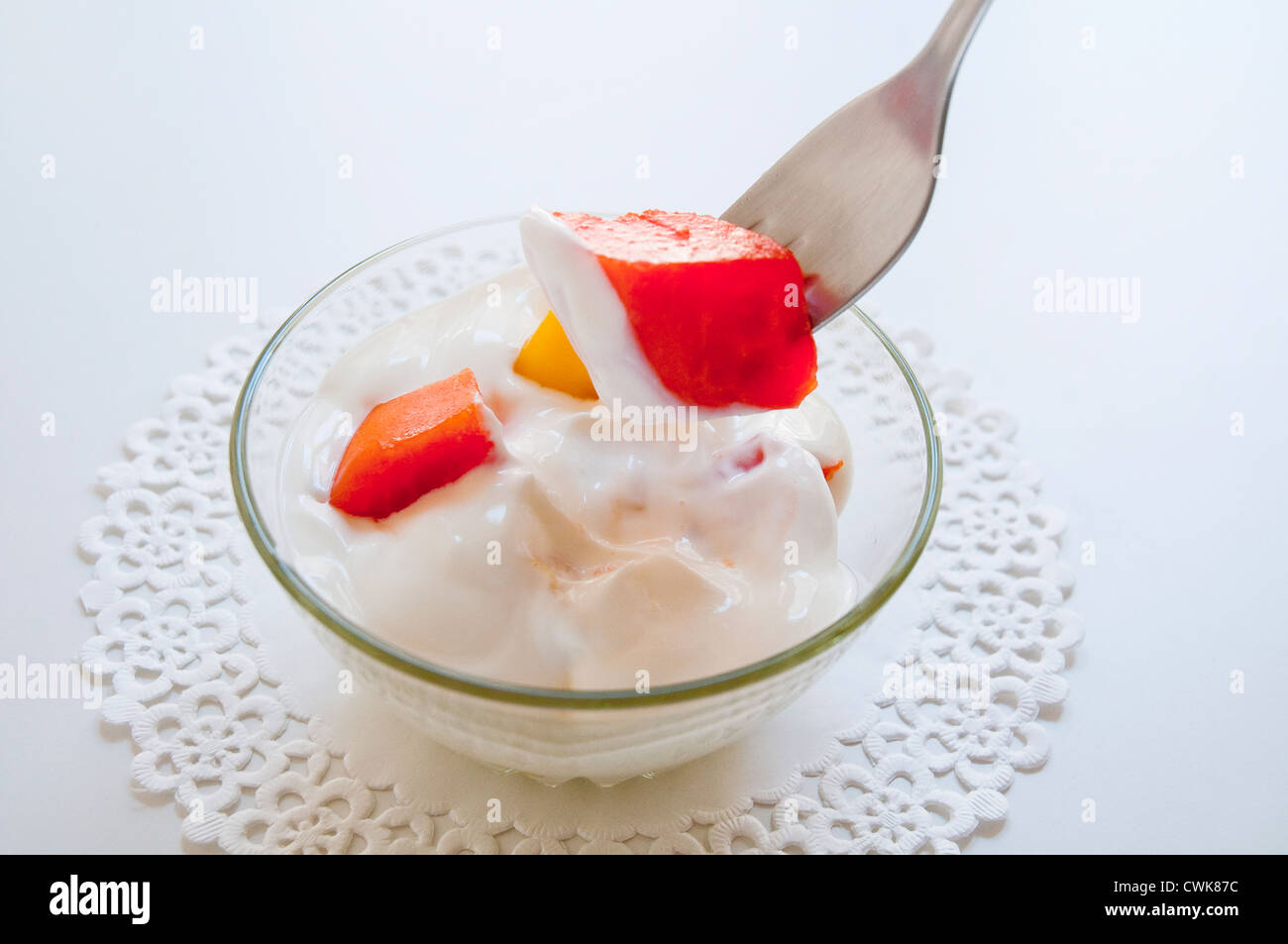 Dessert: tropical fruits with yoghurt cream. Stock Photo