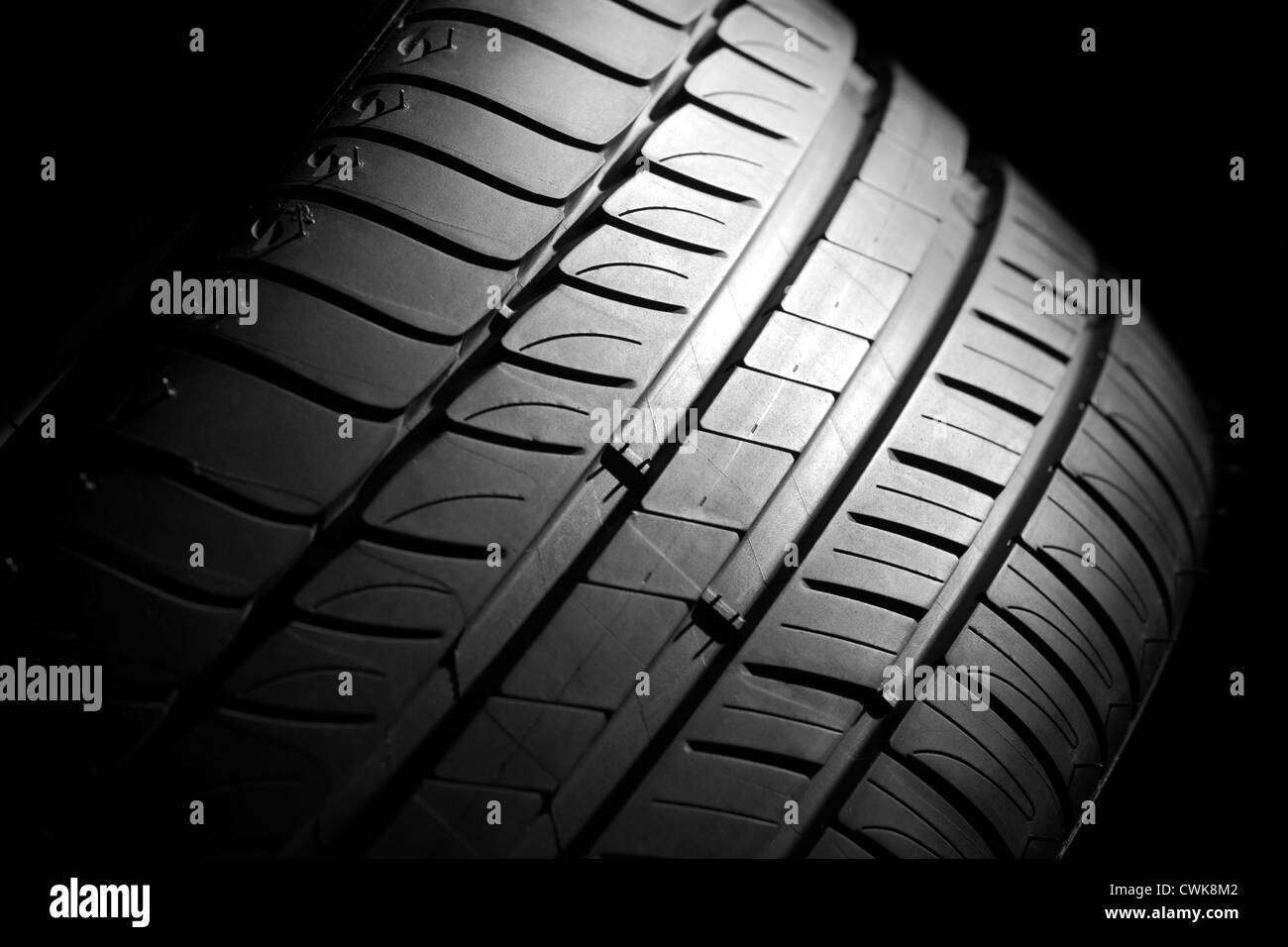 Modern highperformance sport summer tire on a black background. Low