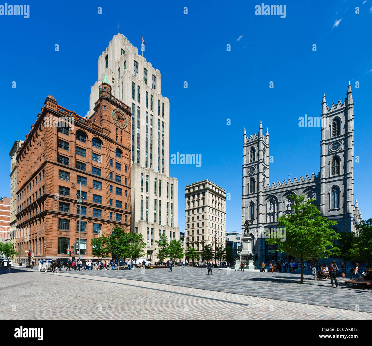 Downtown office buildings and the Basilica of Notre-Dame in the Place d'Armes, Vieux Montreal, Montreal, Quebec, Canada Stock Photo