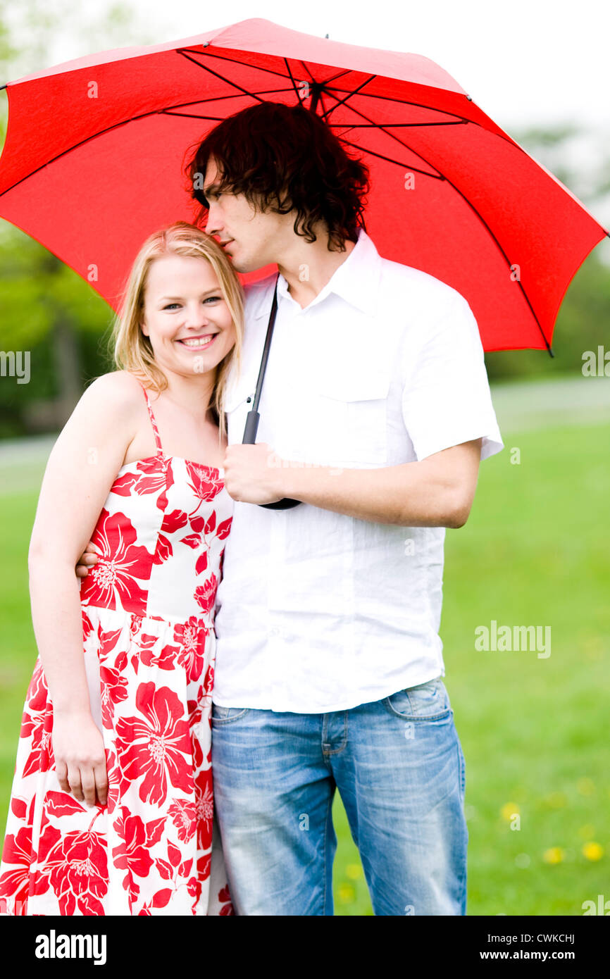 Couple with Red Umbrella Stock Photo Alamy