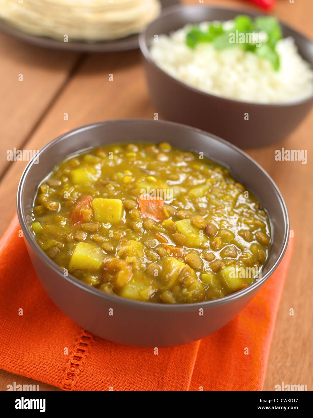 Bowl of spicy Indian dal (lentil) curry prepared with carrot and potato ...