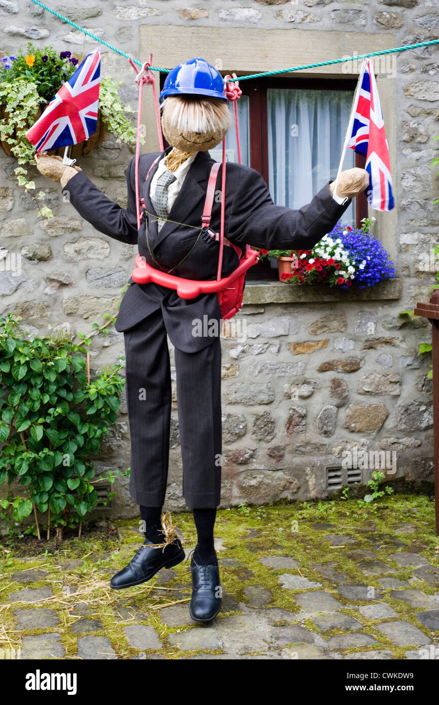scarecrow at kettlewell festival depicting boris johnson on a zip wire Stock Photo