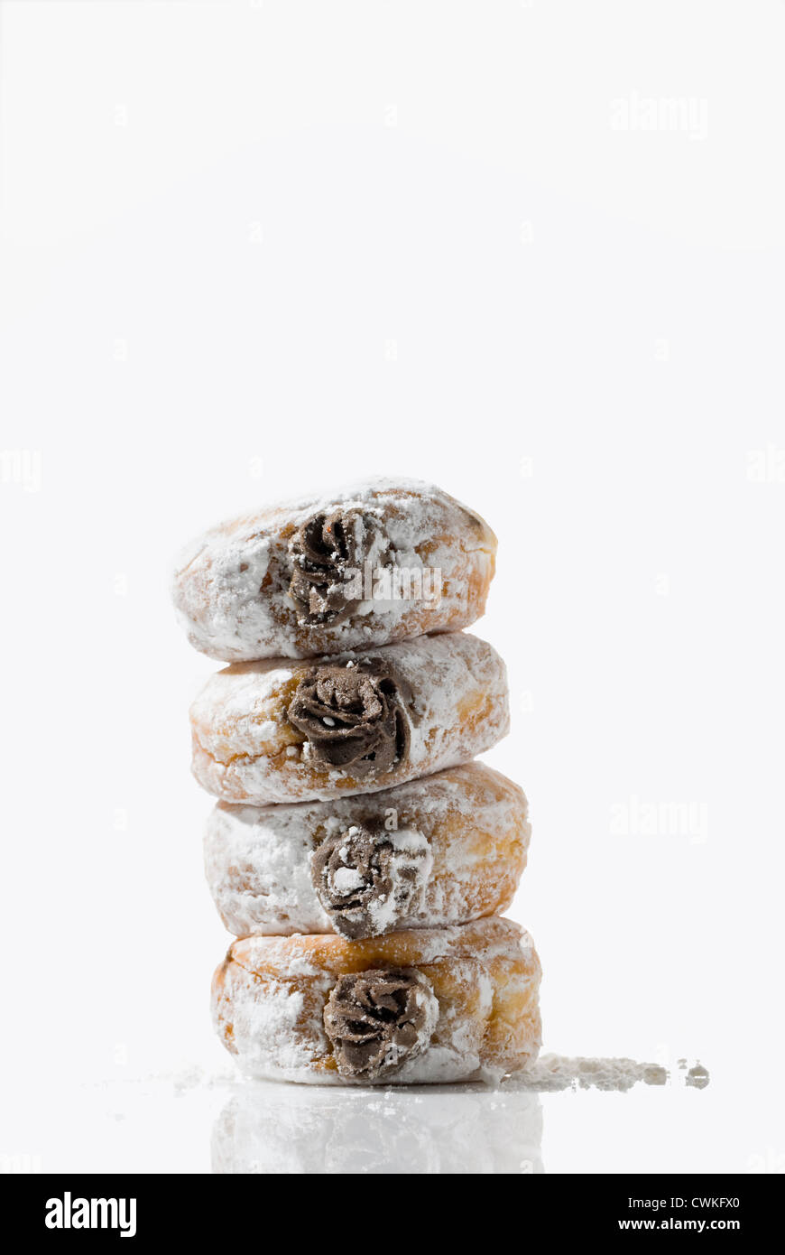 A leaning tower of temptingly delicious strawberry-filled donuts Stock ...