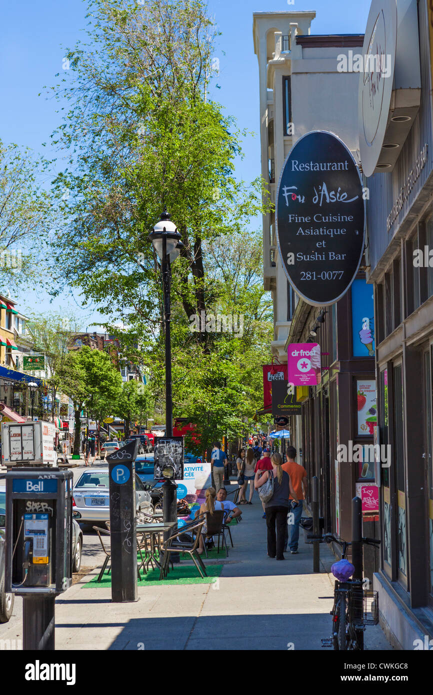 Bars, cafes, restaurants and shops along Rue Saint-Denis in the Quartier Latin (Latin Quarter), Montreal, Quebec, Canada Stock Photo