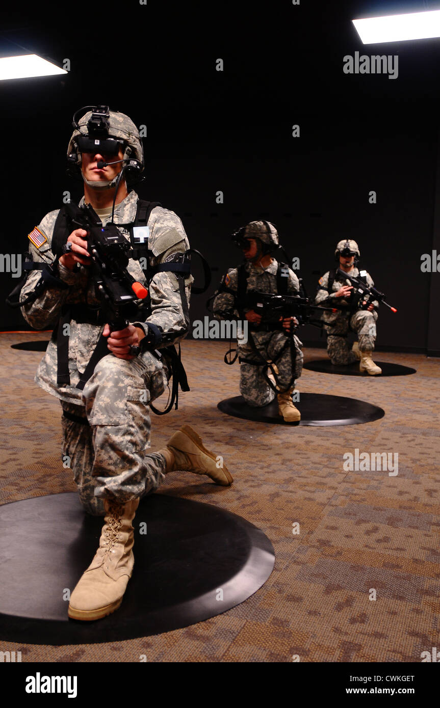 US Paratroopers conduct simulated missions July 26, 2012 at Fort Bragg, NC using the Dismounted Soldier Training System, a virtual reality environment with unlimited mission possibilities. Stock Photo