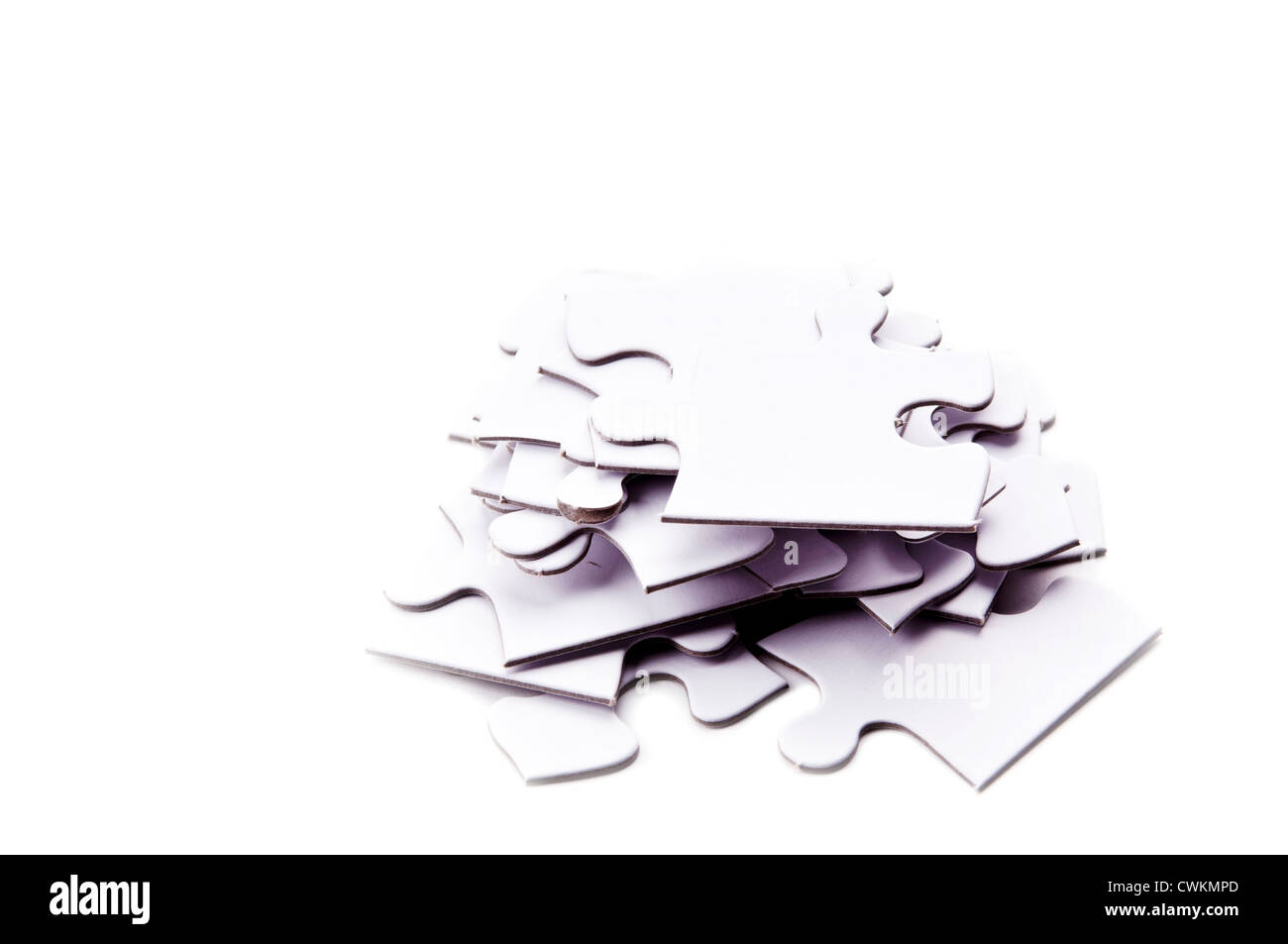 Jigsaw puzzle pieces in a pile out of order Stock Photo Alamy