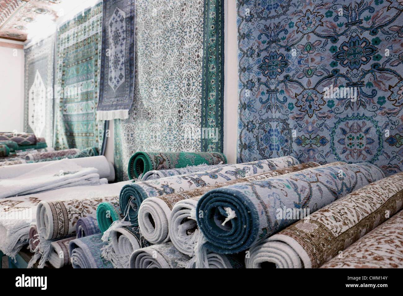 Handmade carpets in a bazaar of the tunisian Kairouan Stock Photo