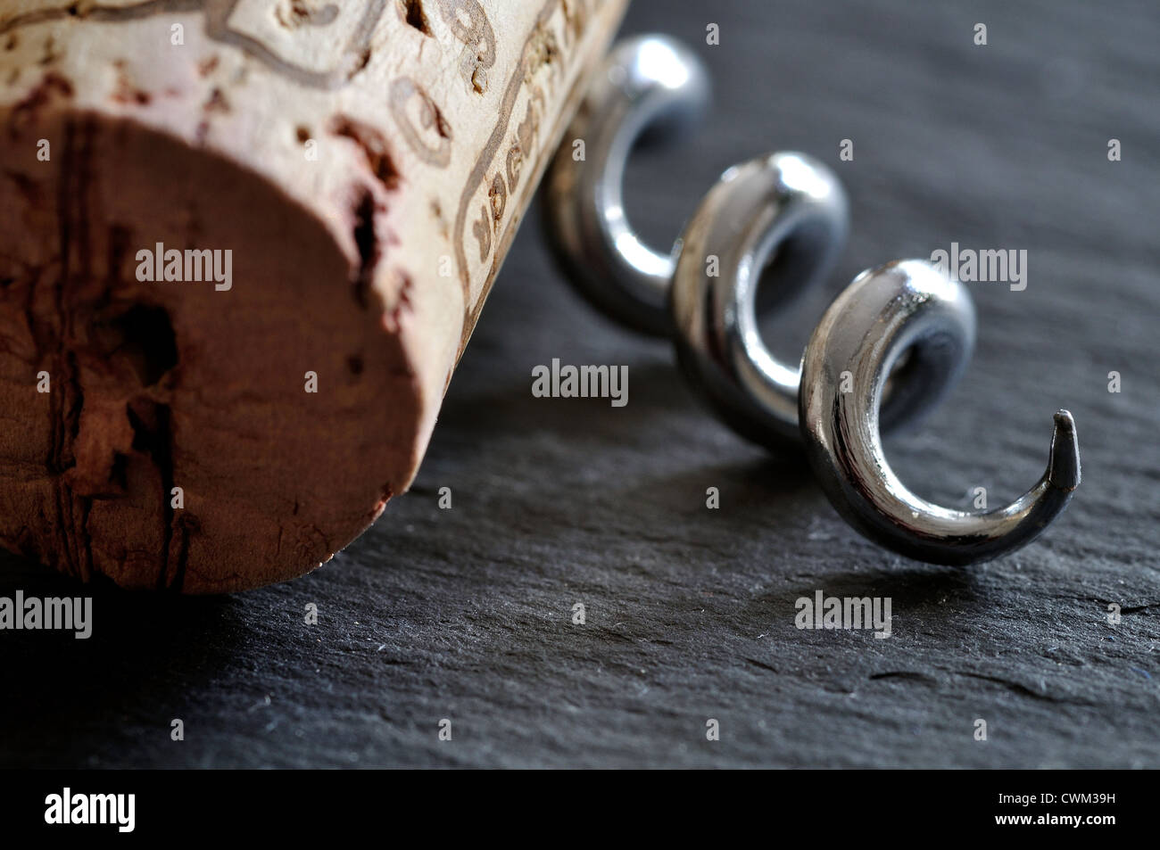 Macro Cork and corkscrew on slate Stock Photo