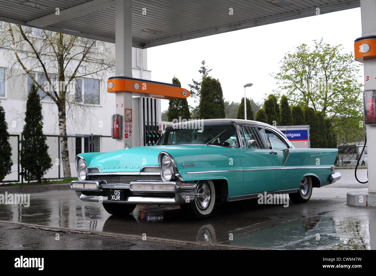 Old American car (from fifties) at gas station - Lincoln Premiere Stock Photo