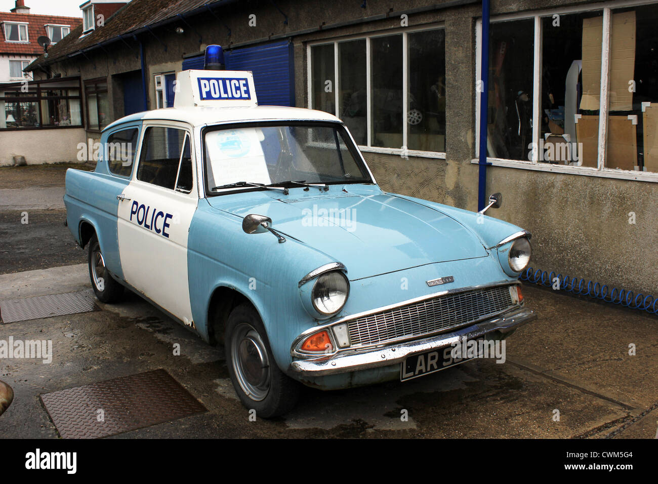 Aidensfield Garage Goathland made famous as a location for TV series Heartbeat  showing police car used in series Stock Photo