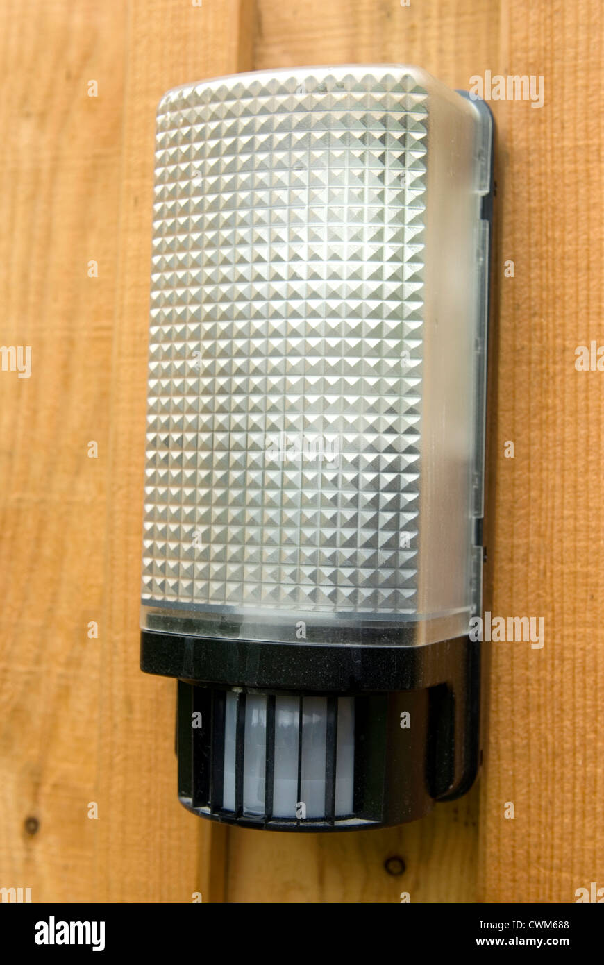 Close up of a plastic PIR exterior light fitting on a porch in rural Scotland Stock Photo