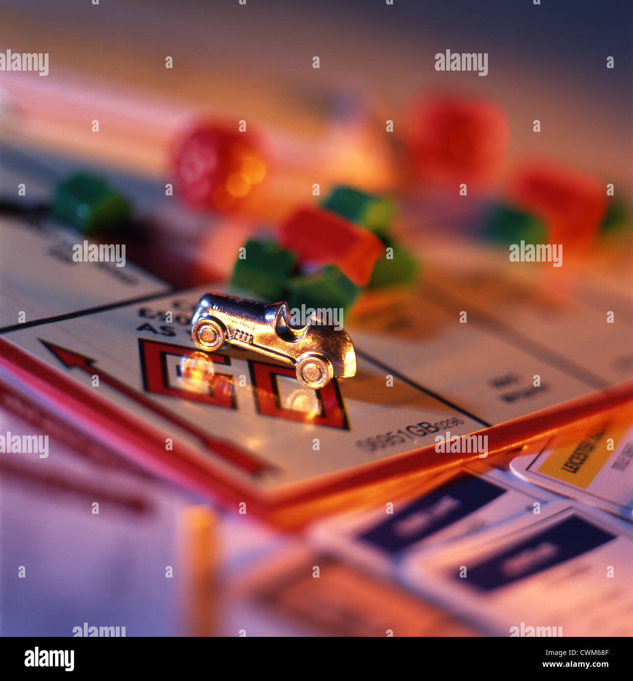 Close up of sports car at 'go' on a Monopoly board game. Stock Photo