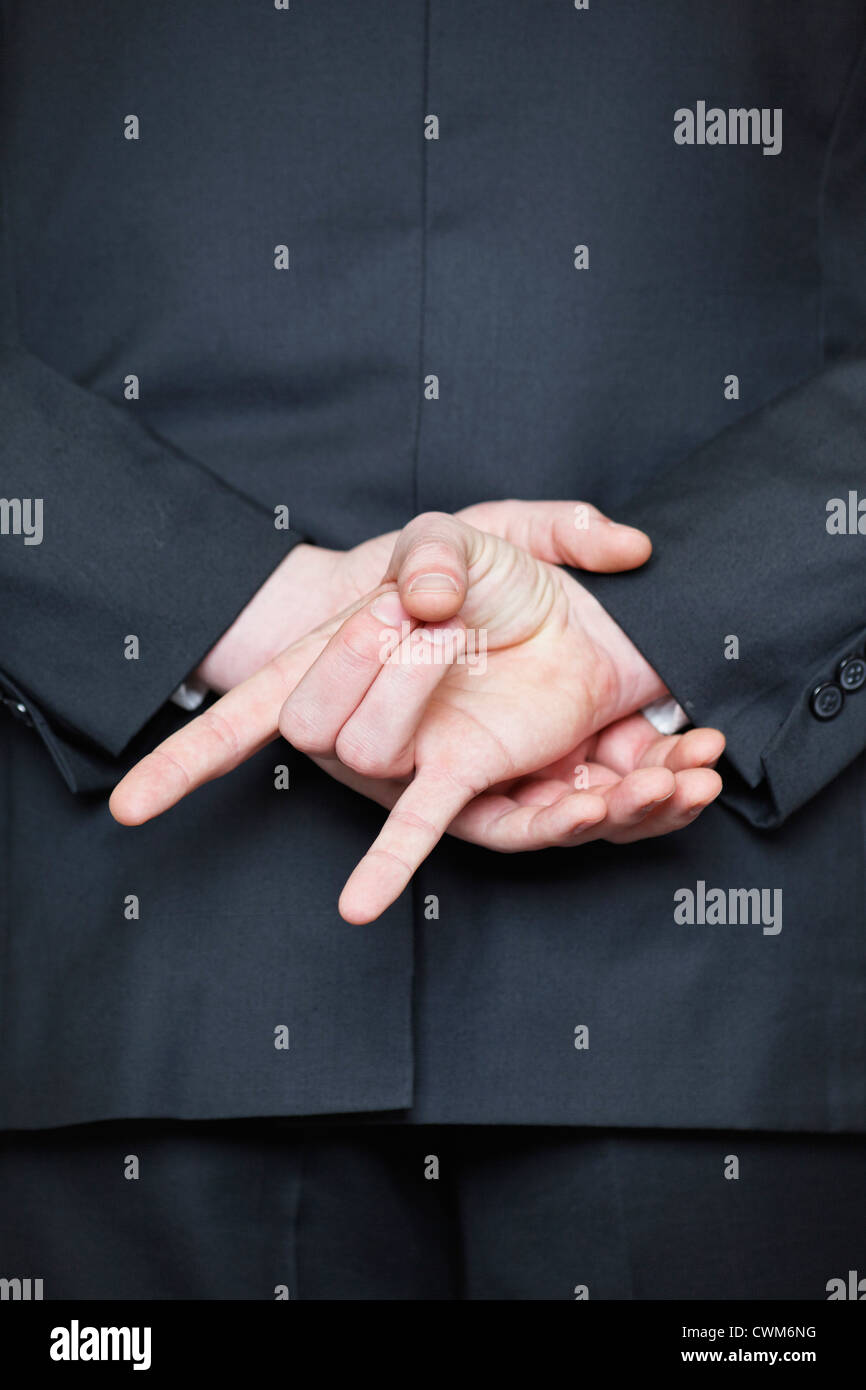 Germany, Businessman showing rock and roll sign, close up Stock Photo