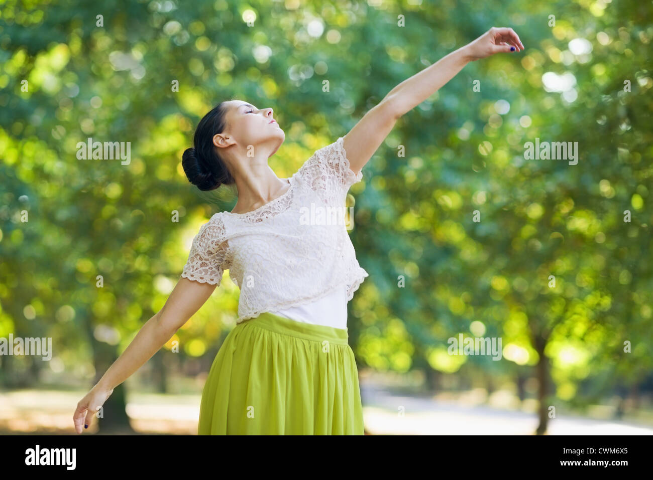 Young woman dancing in park Stock Photo - Alamy