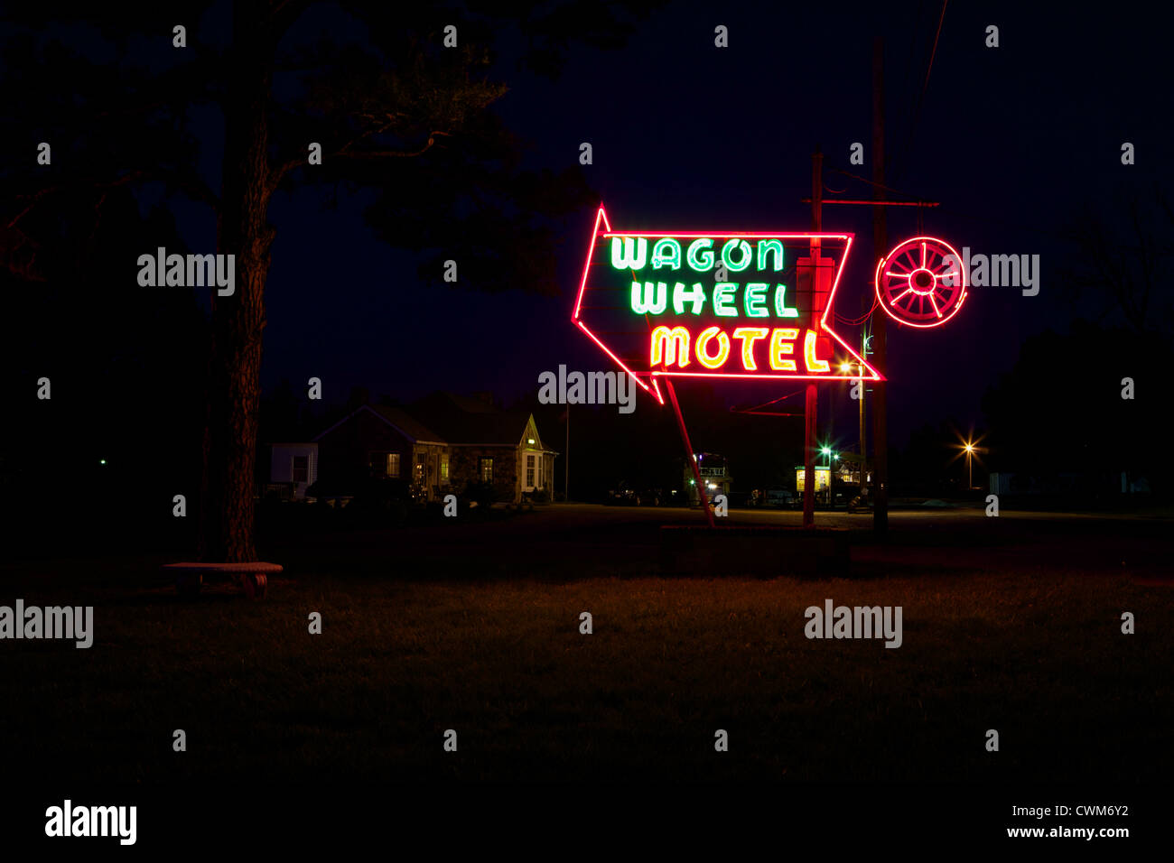 The Wagon Wheel Motel neon sign lit up at night on Route 66 Stock Photo