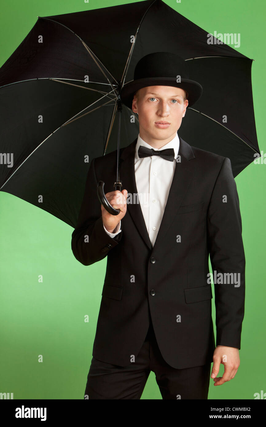 Bowler hat man umbrella hi-res stock photography and images - Alamy