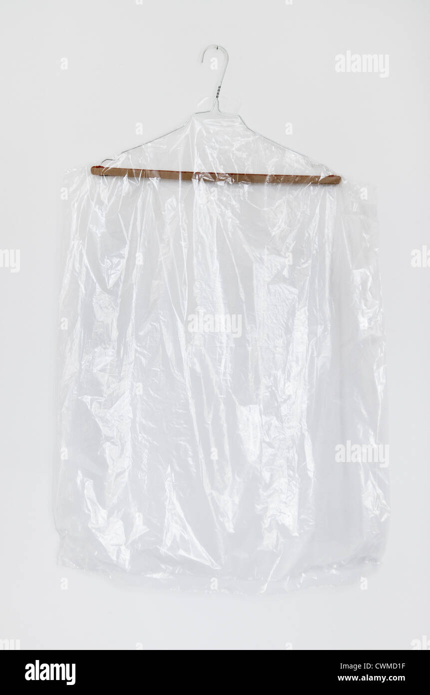Plastic clothes in coathanger on white background Stock Photo Alamy