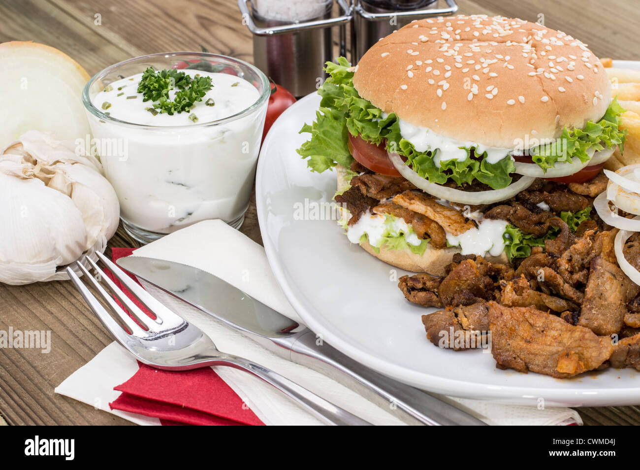 Kebab Burger with meat and Chips on wooden background Stock Photo