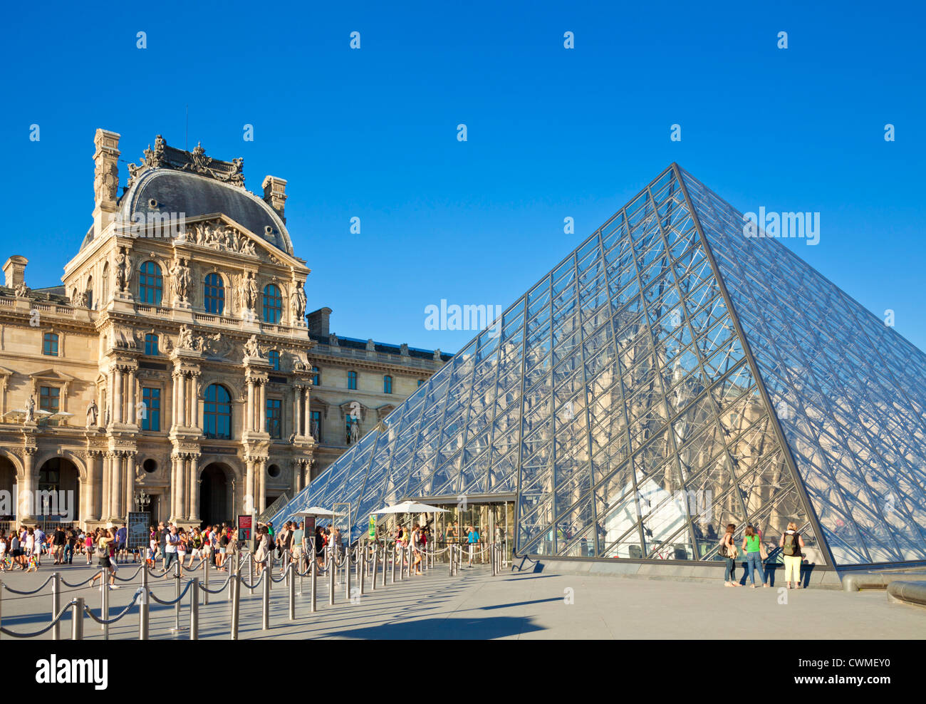 Visitors outside  the Louvre art gallery and Museum entrance Paris France EU Europe Stock Photo