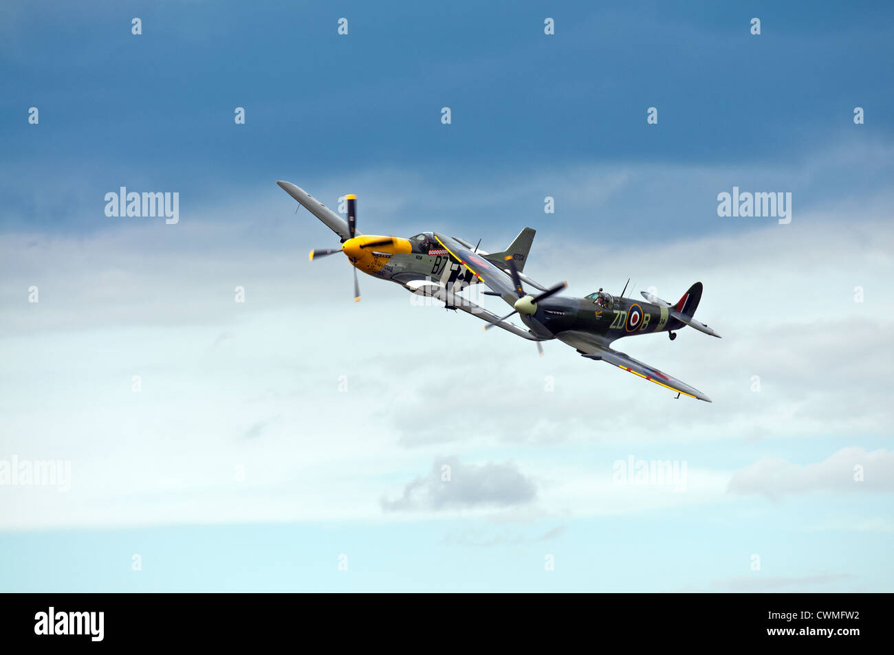 Spitfire and P51 Mustang flying a closer formation Stock Photo