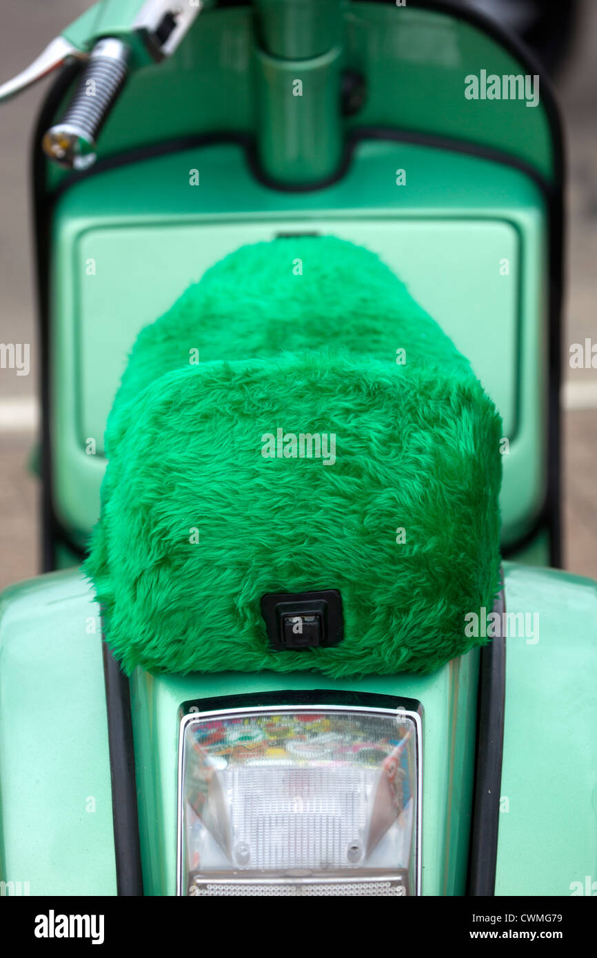 Neon Green Furry Seat on Classic Vespa Scooter Stock Photo