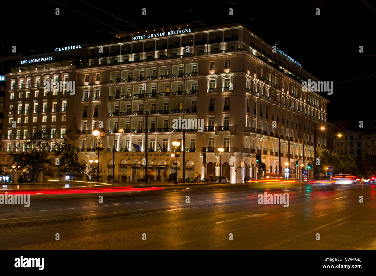 Traffic leaves trails outside the Grande Bretagne hotel in Syntagma Square. August 2012 Stock Photo
