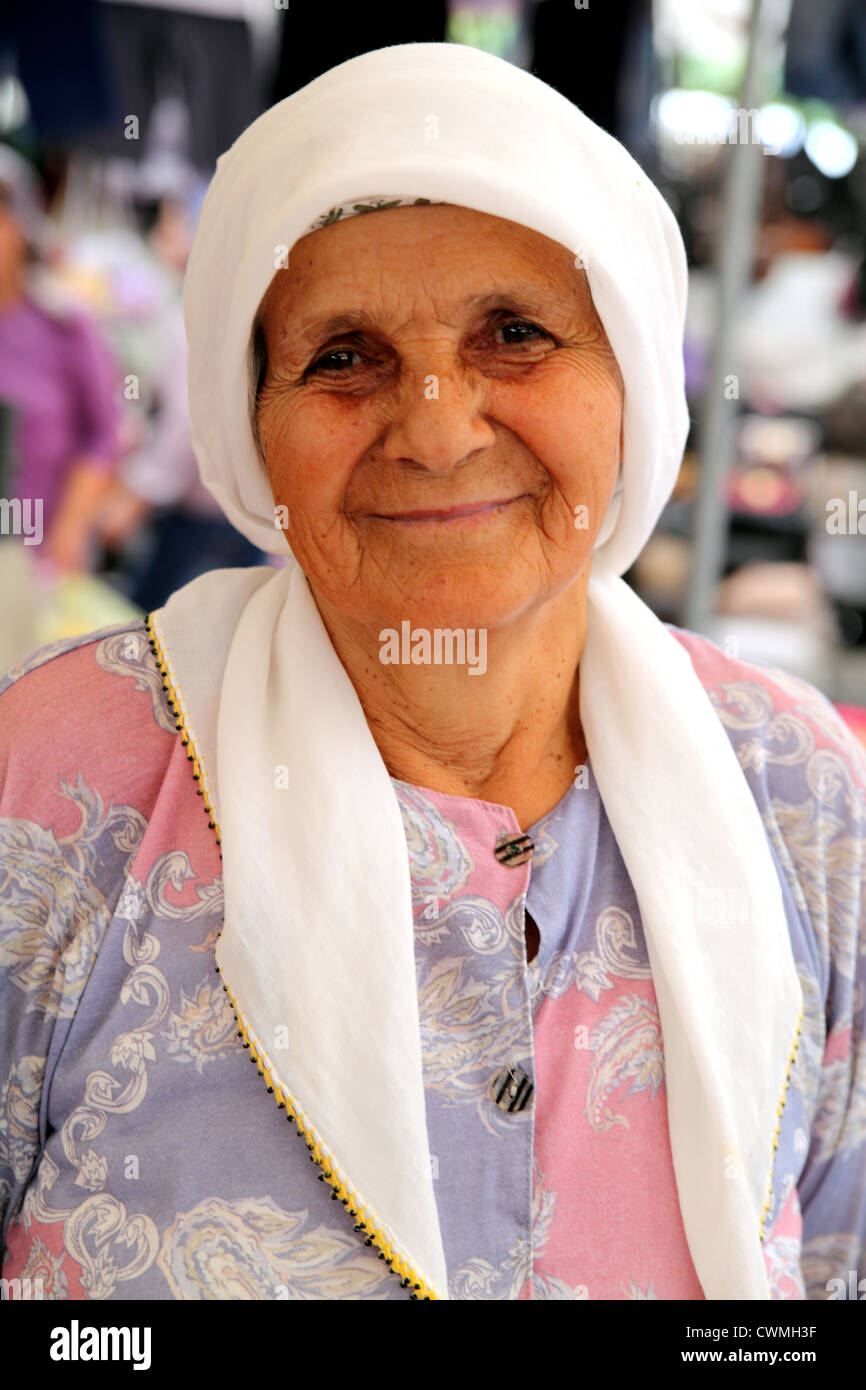 Upright portrait of elderly Turkish woman market stallholder in Kocegiz near Dalyan Turkey Stock Photo