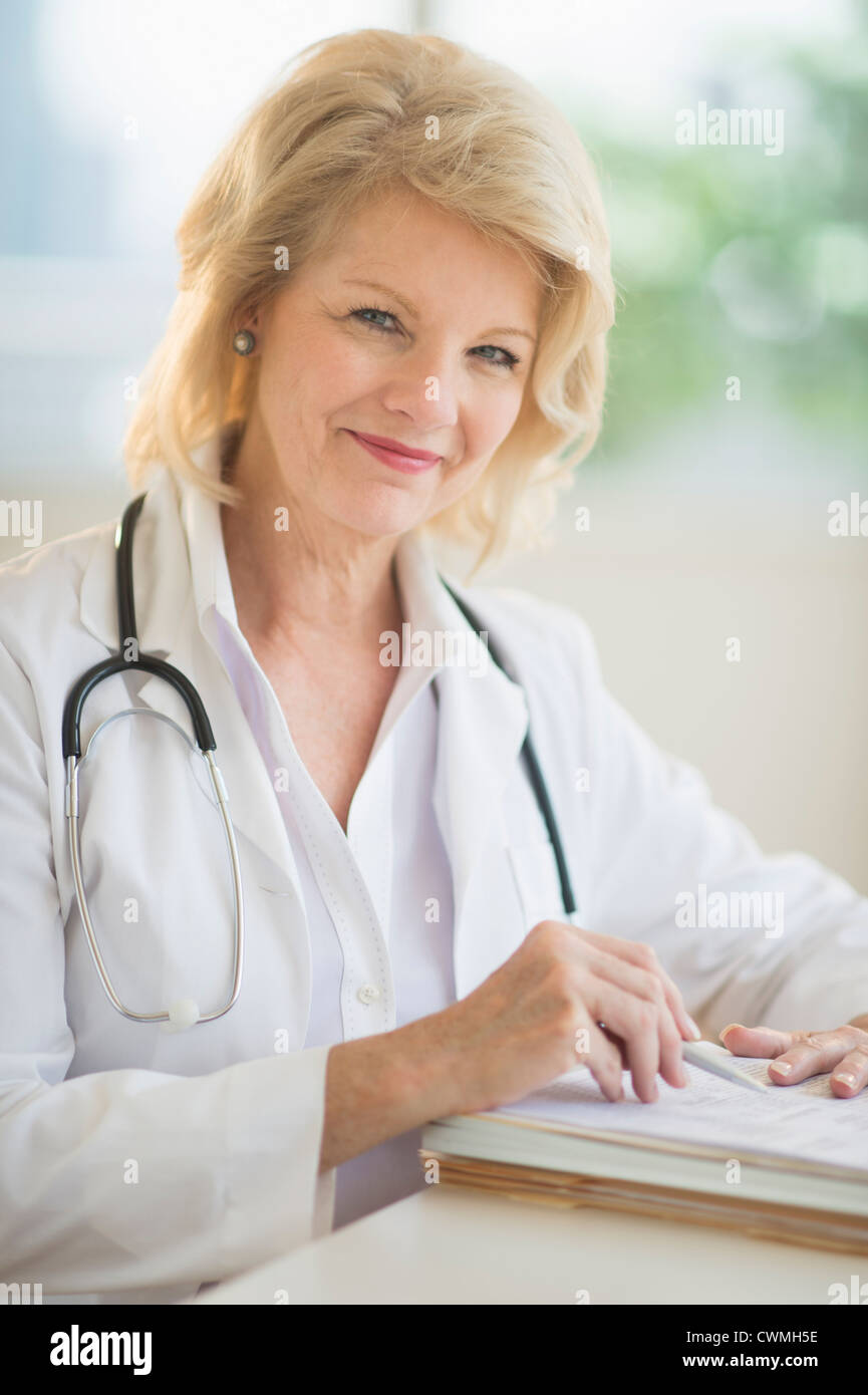Contemporary mature female doctor hi-res stock photography and images ...