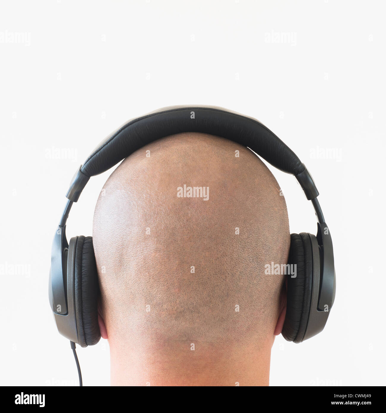 Back view of man with headphones on head Stock Photo