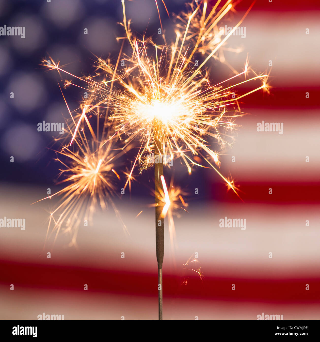 Sparkler and American flag Stock Photo - Alamy