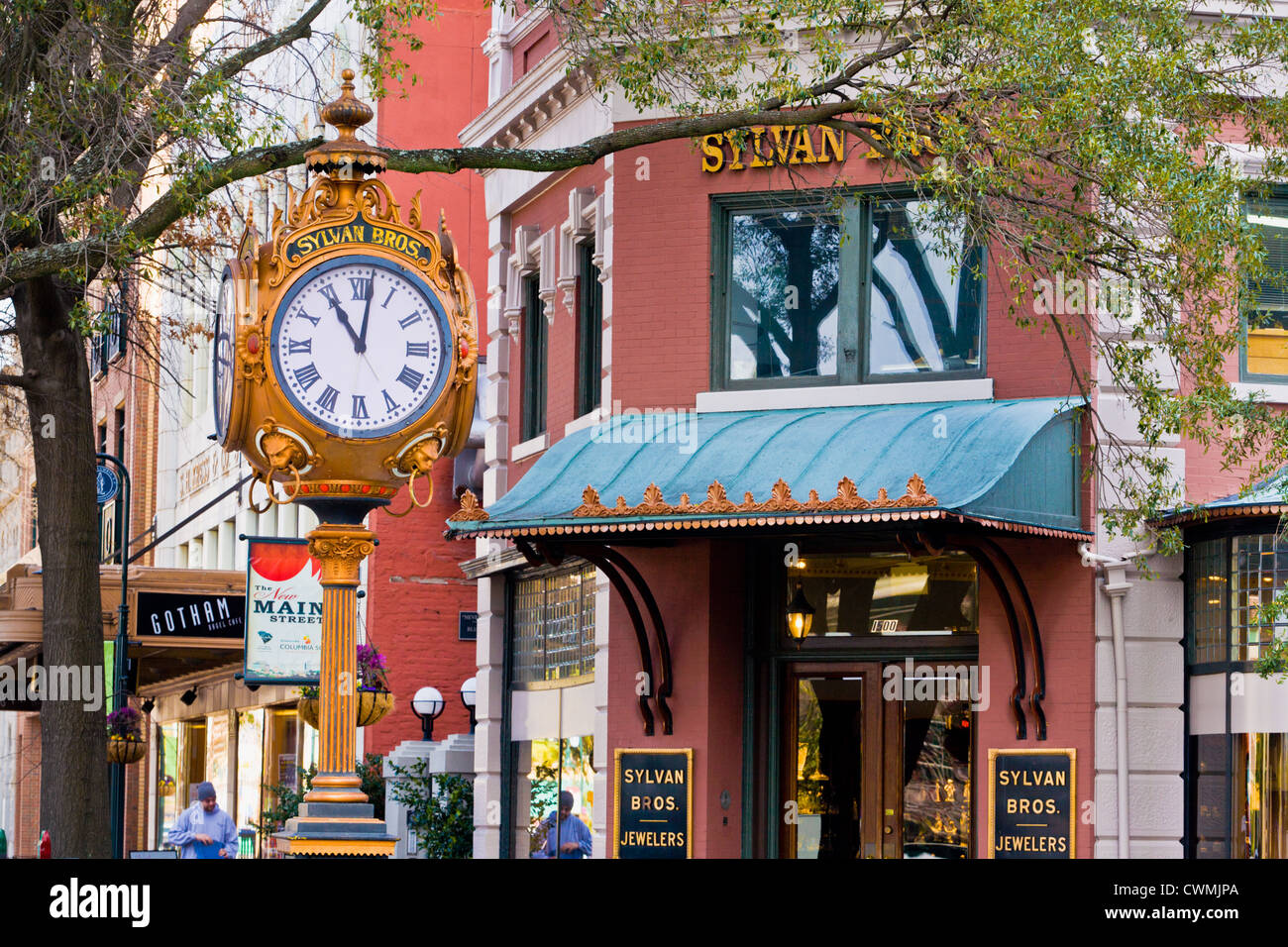 Ornate clock of Sylvan Bros. Jewelers, and Main Street shops, Columbia, South Carolina, USA. Stock Photo