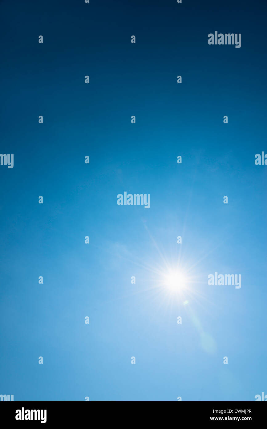 Clear blue sky and solar flare Stock Photo