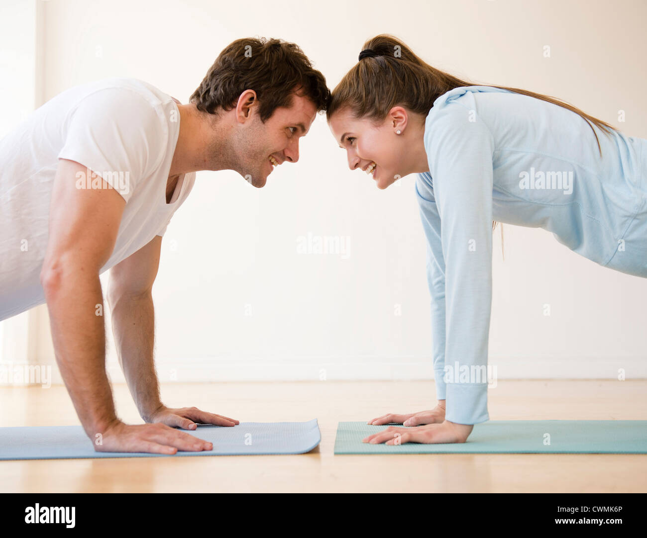 USA, New Jersey, Jersey City, Happy young couple exercising together Stock Photo