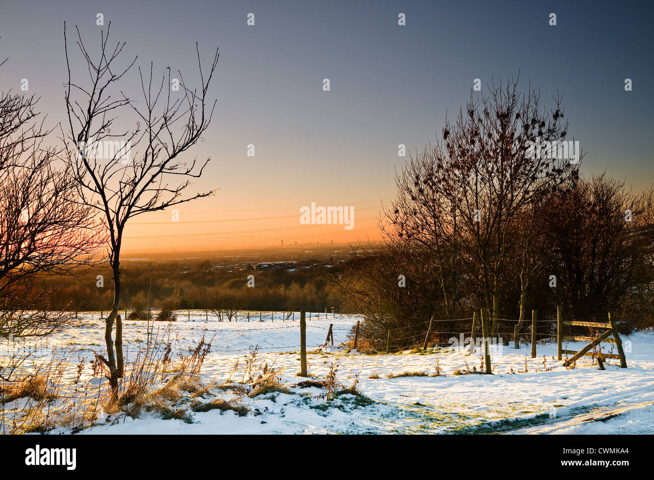 sunset and snow at ashton under lyne Stock Photo